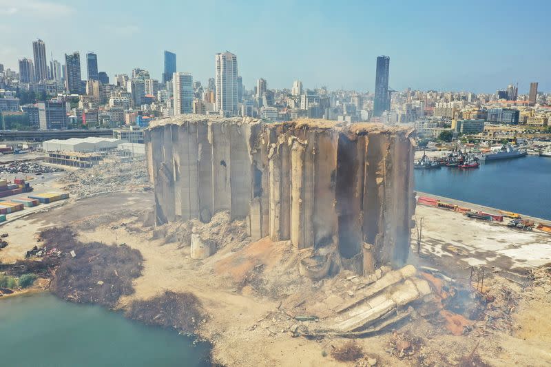 Smoke rises from the partially-collapsed Beirut grain silos, damaged in the August 2020 port blast, in Beirut