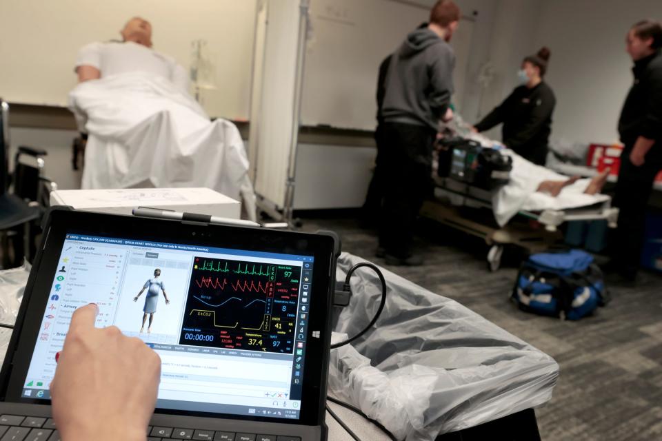 An iPad is used to show vital signs, control breathing and the severity of seizures wirelessly on a mannequin during scenario training for paramedic students enrolled in the 13-month course at the Medstar offices in Clinton Township on Wednesday, Nov. 1, 2023.