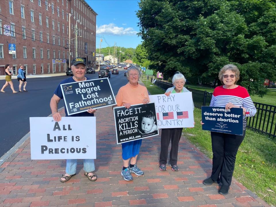 Claude Malo, left Mary Ann Cooper, Brenda Cameron, and Phyllis Woods, who oppose abortion, counter abortion rights activists at the "Bans Off Our Bodies" rally in Dover on Friday, June 24, 2022.