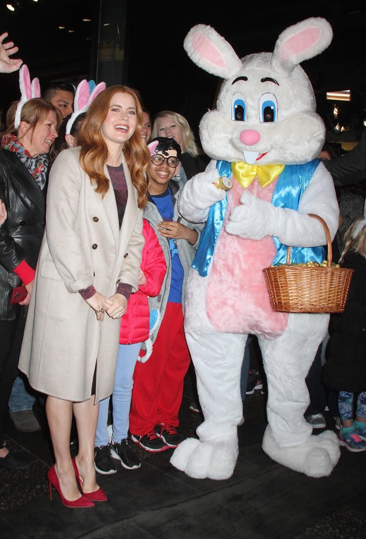 Amy Adams’s close encounter with the Easter Bunny. (Photo: Splash Images)