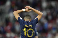 France's Kylian Mbappe celebrates scoring his side's third goal during the World Cup round of 16 soccer match between France and Poland, at the Al Thumama Stadium in Doha, Qatar, Sunday, Dec. 4, 2022. (AP Photo/Martin Meissner)