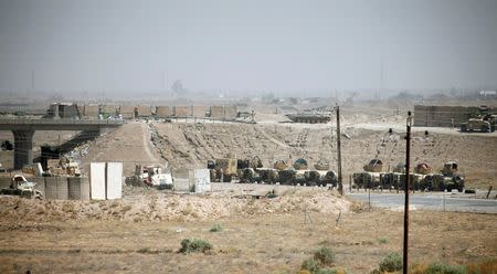 Iraqi army vehicles are seen in Falluja, Iraq, June 17, 2016. REUTERS/Thaier Al-Sudani