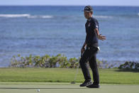 Kevin Na reacts to his putt on the 17th green during the third round at the Sony Open golf tournament Saturday, Jan. 16, 2021, in Honolulu. (AP Photo/Marco Garcia)