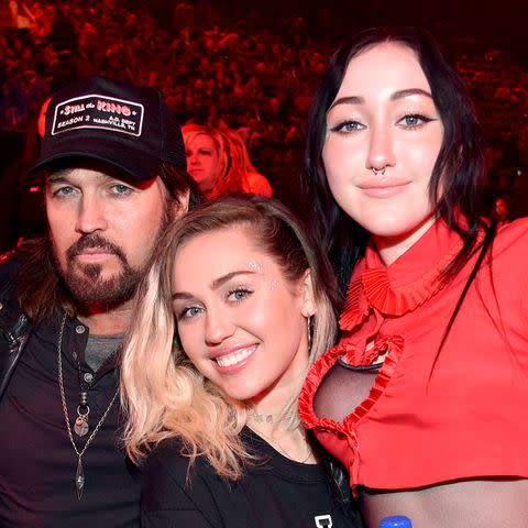 <p>Kevin Mazur/Getty</p> Billy Ray, Miley and Noah Cyrus