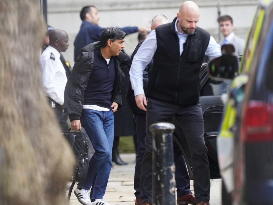 Rishi Sunak exits Downing Street from rear entrance following protest (PA)