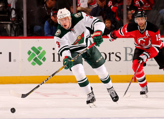 NEWARK, NJ - OCTOBER 22: Charlie Coyle #3 of the Minnesota Wild passes the puck as Travis Zajac #19 of the New Jersey Devils defends on October 22, 2016 at Prudential Center in Newark, New Jersey. (Photo by Elsa/Getty Images)