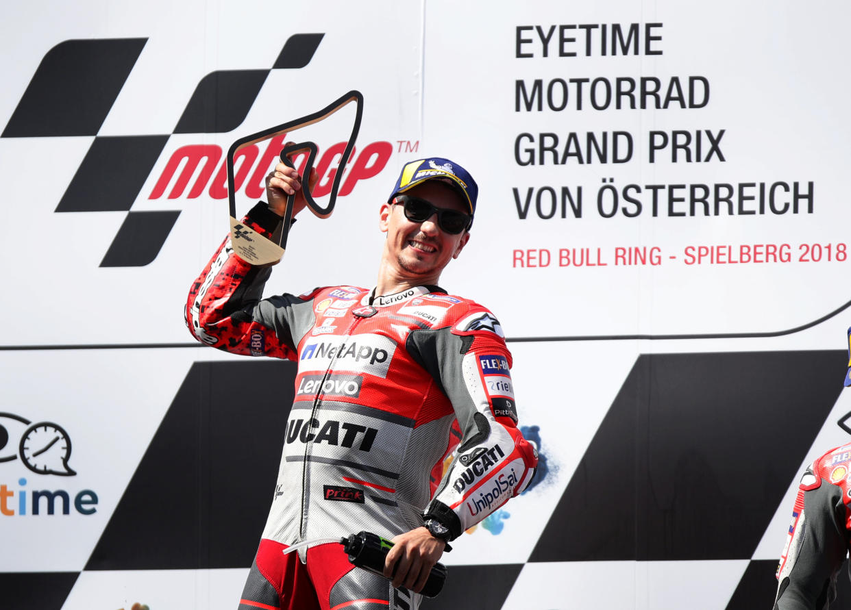 Motorcycling – MotoGP – Austrian Grand Prix – Red Bull Ring, Speilberg, Austria – August 12, 2018 Ducati Team’s Jorge Lorenzo celebrates with the trophy on the podium after winning the race REUTERS/Lisi Niesner