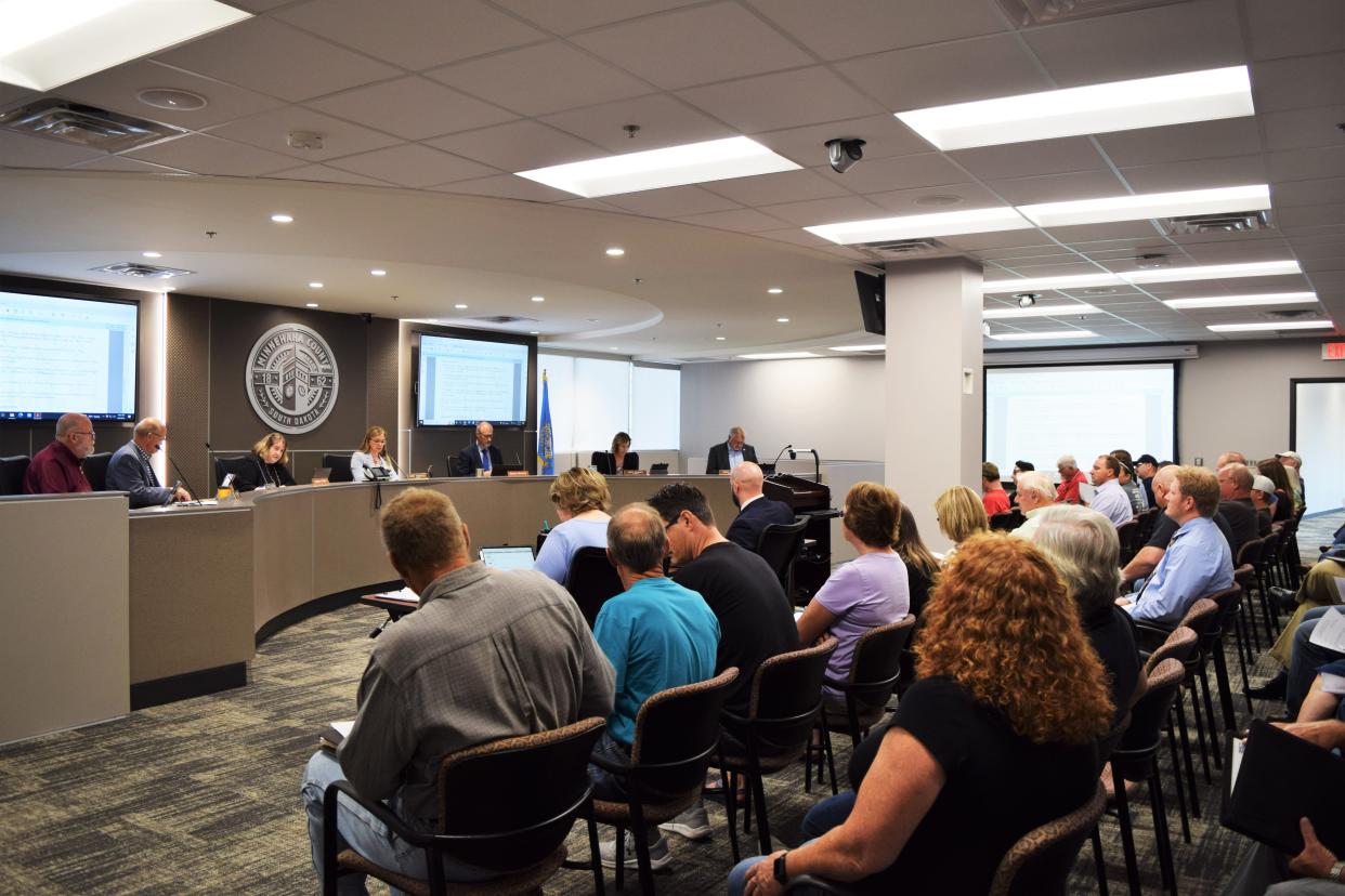 A group of over 20 residents listening in on Minnehaha County Commission's discussion considering a twelve-month moratorium on pipelines, just weeks after Brown County approved a similar moratorium to halt Iowa-based Summit Carbon Solution's permitting process for their planned CO2 pipeline. Photo taken at the new Minnehaha County Commission room on Tuesday, August 2, 2022.