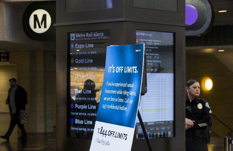 Los Angeles County Metropolitan Transportation Authority Metro Senior Transit officer Loretta Ferem, far right, stands on guard, as Metro officials announce the "It's Off Limits" campaign at Union Station in Los Angeles, Wednesday, Jan. 11, 2017. Metro has launched an around-the-clock counseling hotline to provide support to riders who experience unwanted sexual advances. The "It's Off Limits" hotline was unveiled Wednesday. The launch is part of a campaign encouraging riders to report sexual harassment on trains and buses. (AP Photo/Damian Dovarganes)