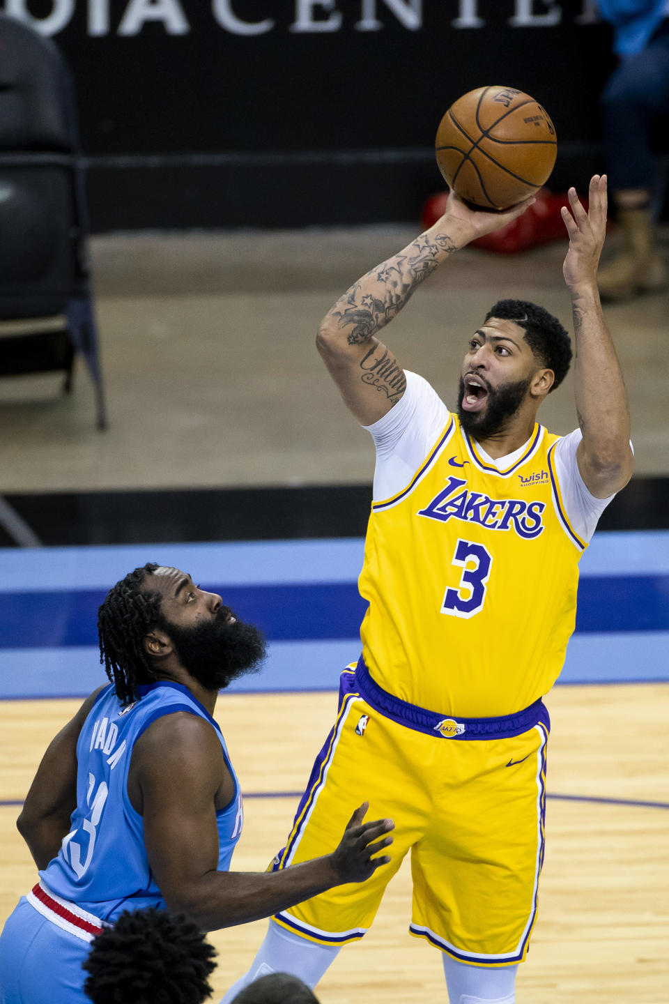 Los Angeles Lakers forward Anthony Davis (3) shoots over Houston Rockets guard James Harden (13) during an NBA basketball game Tuesday, Jan. 12, 2021, in Houston. (Mark Mulligan/Houston Chronicle via AP)