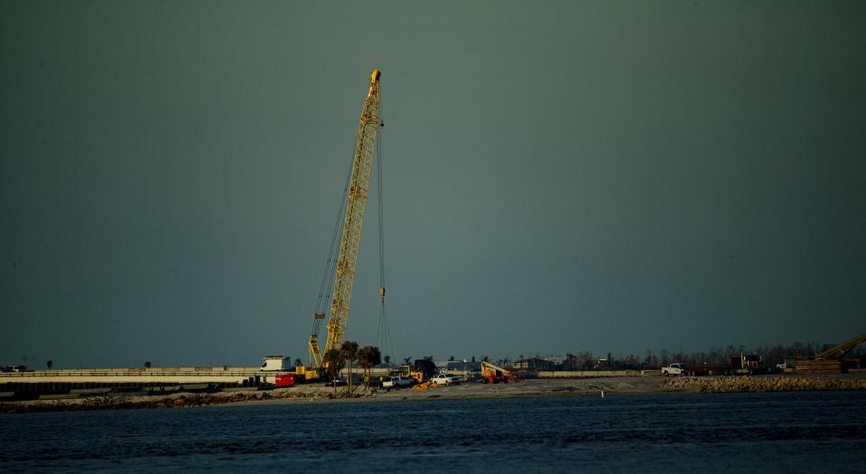 Work continues on the Sanibel Causeway on Thursday, Jan. 19, 2023. The chain of spoil islands that connects Fort Myers to Sanibel and Captiva was damaged in Hurricane Ian.  