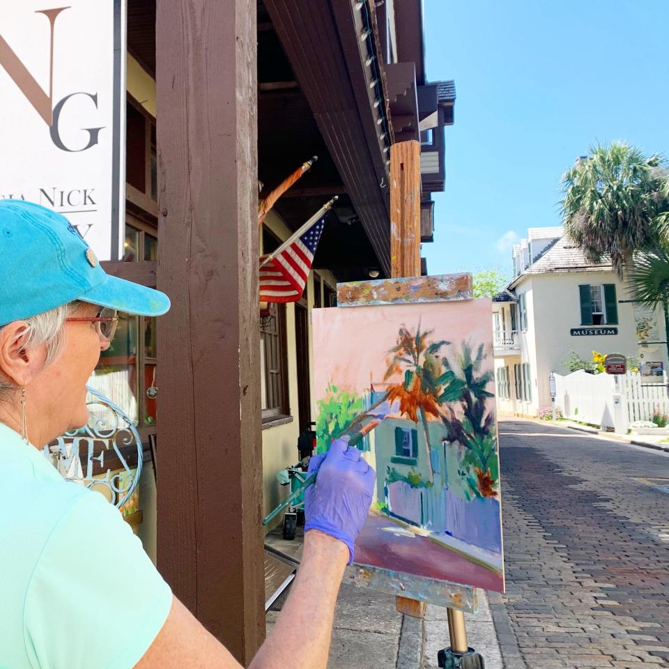 Professional artist Christ Kling paints on Aviles Street, with a view of the circa 1798 Ximenez Fatio House. Aviles Street is the oldest in America, on a map from the 1580s, which is the oldest item in the U.S. National Archives.