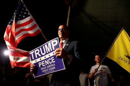 Supporters listen to a pre-recorded message by the U.S. presidential nominee Donald Trump during a convention organised by the Israeli branch of the U.S. Republican party campaigning for Trump, in Jerusalem October 26, 2016. REUTERS/Ammar Awad/File Photo