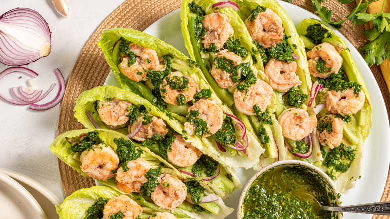 Shrimp lettuce wraps with chimichurri sauce on a plate