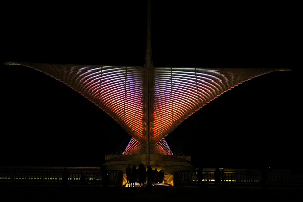The Burke Brise Soleil (wings) of the Quadracci Pavilion are illuminated Thursday, Dec. 21, 2023, at the Milwaukee Art Museum in Milwaukee. Ebony Cox / Milwaukee Journal Sentinel