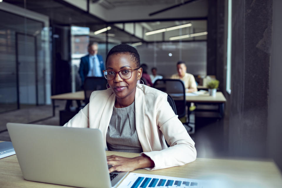 Close up of a young businesswoman working in an office. (Source: Getty)