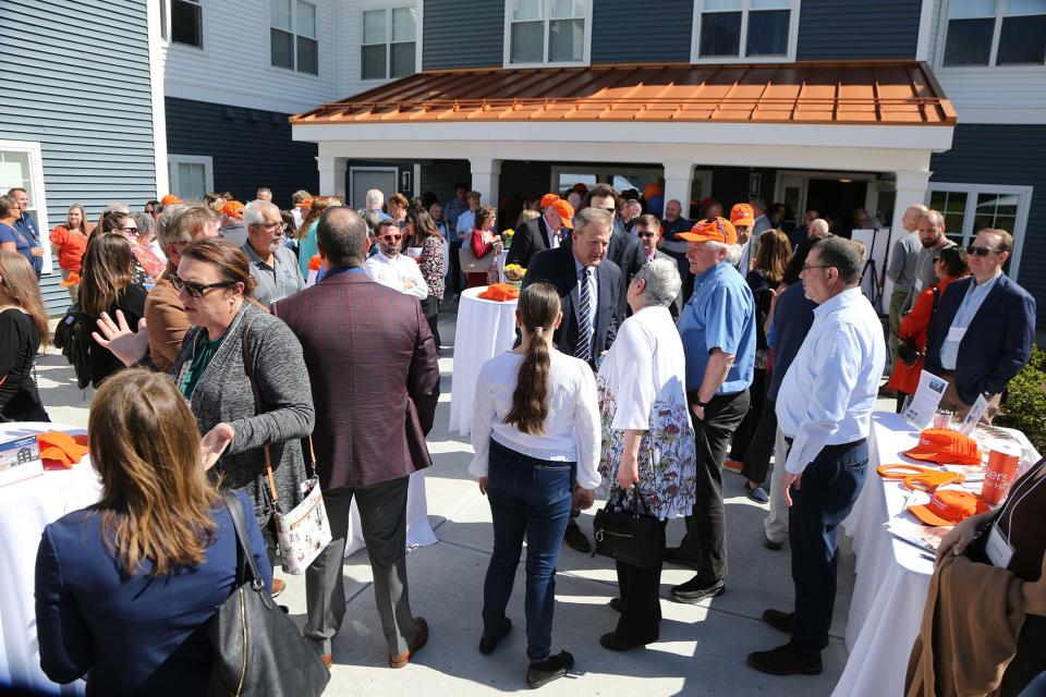 Gov. Chris Sununu, center, participates in a ceremony celebrating Easterseals' Champlin Place in Rochester Monday, May 13, 2024.