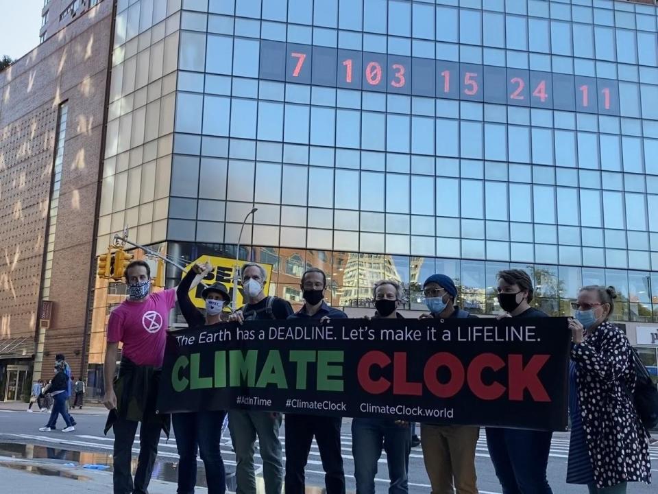 The Climate Clock team minutes after the display was switched over on Saturday, Sept. 19, 2020. / Credit: Jeff Berardelli/CBS News