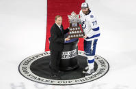 Tampa Bay Lightning defenseman Victor Hedman (77) is presented the Conn Smythe Trophy by NHL Commissioner Gary Bettman after defeating the Dallas Stars to win the Stanley Cup in Edmonton, Alberta, on Monday, Sept. 28, 2020. (Jason Franson/The Canadian Press via AP)