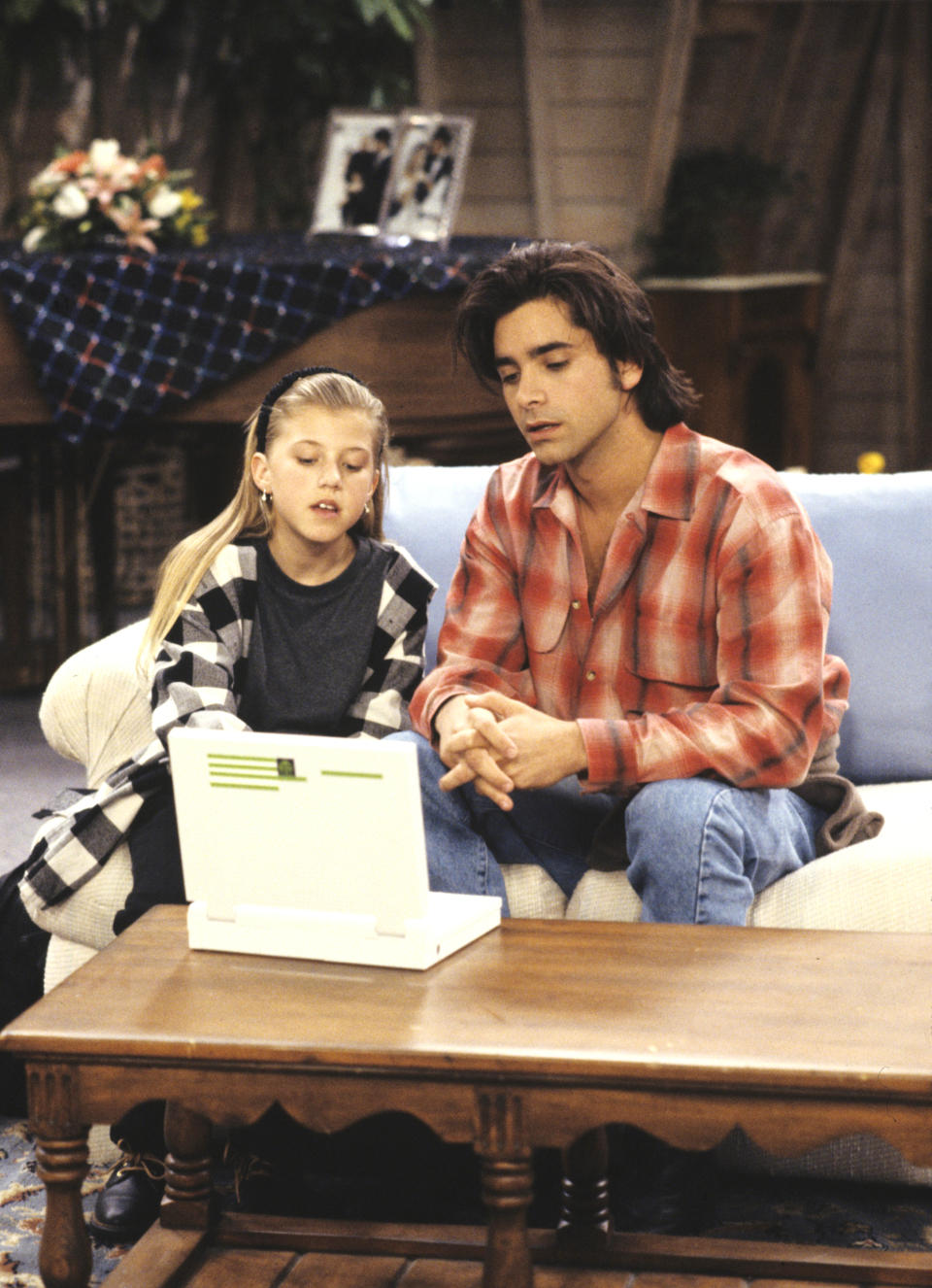 john and jodie looking at a computer in a scene