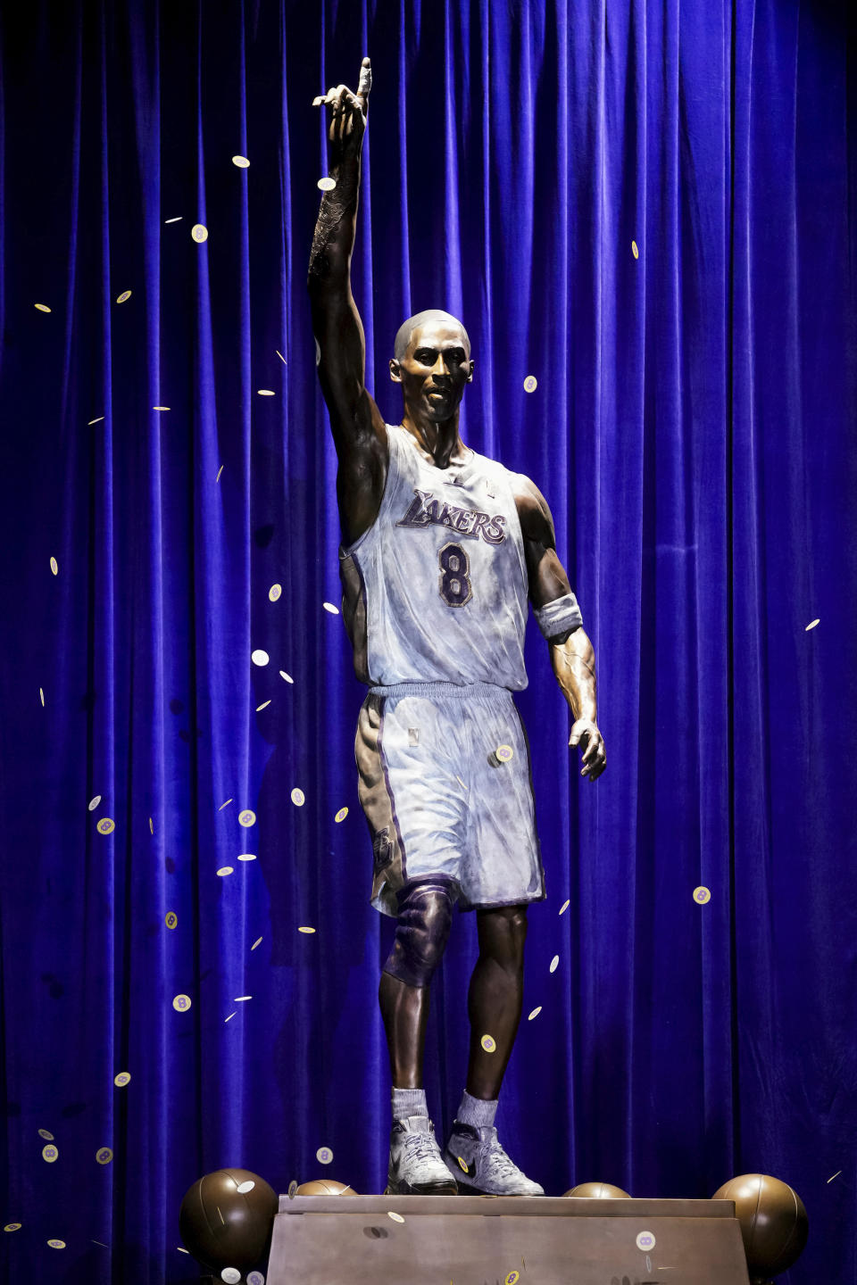 Confetti is released during the unveiling of a statue in honor of former Los Angeles Lakers guard Kobe Bryant outside the NBA basketball team's arena Thursday, Feb. 8, 2024, in Los Angeles. (AP Photo/Eric Thayer)