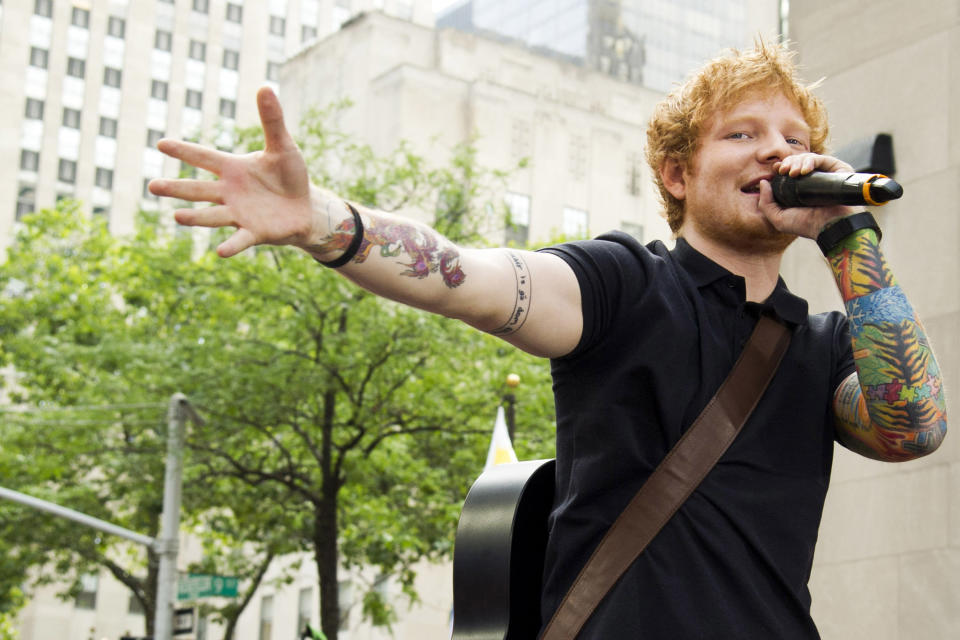 FILE - This July 12, 2013 file photo shows Ed Sheeran performing on NBC's "Today" show in New York. Sheeran is part of a breed of newer and lesser known acts who are able to sell out top venues, even if they aren’t selling millions of albums and singles, or dominating with chart-topping tracks and radio airplay. (Photo by Charles Sykes/Invision/AP, File)