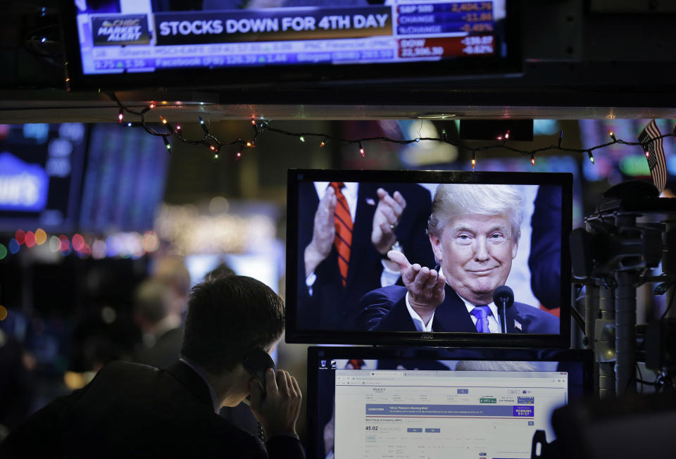 A picture of President Donald Trump is displayed on a computer on the floor of the New York Stock Exchange in New York, Monday, Dec. 24, 2018. (AP Photo/Seth Wenig)