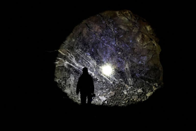 An employee guides inside a tungsten mine in Gangwon Province