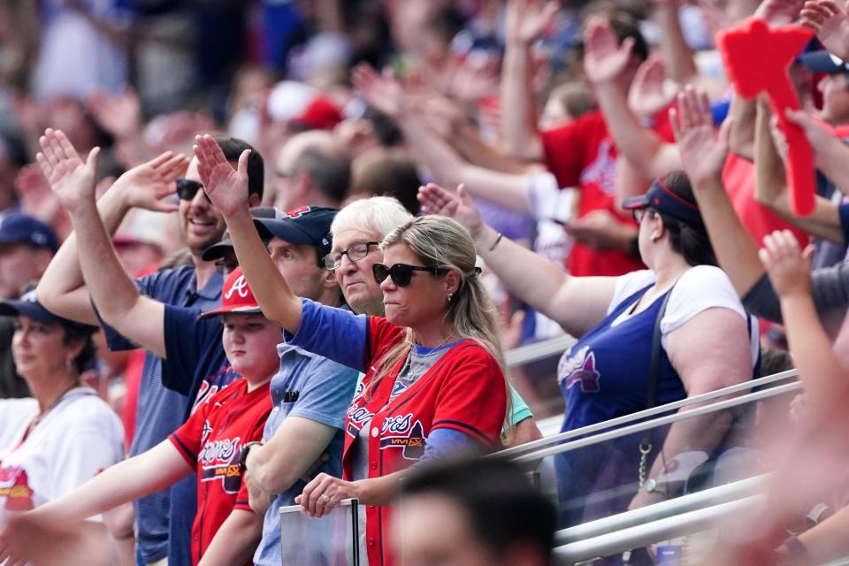 Braves fans do the tomahawk chop during Game 4 of this year's NL division series against the Brewers.