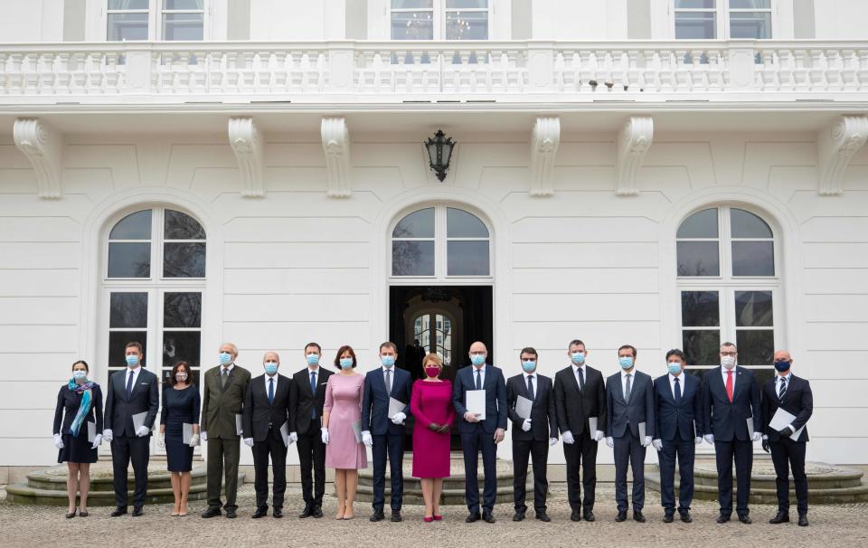 Newly appointed Slovak Prime Minister Igor Matovic (C-L), leader of the OLaNO anti-graft party and President Zuzana Caputova (C-R) pose with Ministers of the new four-party coalition government after a swearing in ceremony on March 21, 2020 outside the Presidential palace in Bratislava. - The ceremony was held without members of the press and all appointed government members wore gloves and face mask to prevent the spread of novel coronavirus. (Photo by JOE KLAMAR / AFP) (Photo by JOE KLAMAR/AFP via Getty Images)