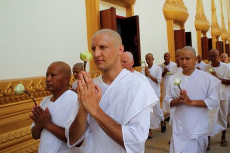 Turkish-German patient Cengiz (C) attends his ordination ceremony at Wat Thamkrabok monastery in Saraburi province, Thailand, March 30, 2017. REUTERS/Jorge Silva