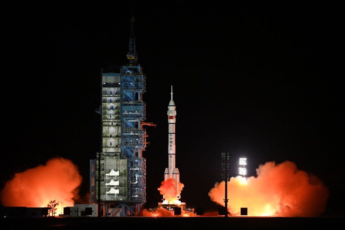 A Long March-2F carrier rocket, carrying the Shenzhou-15 spacecraft with three astronauts to China’s Tiangong space station, lifts off from the Jiuquan Satellite Launch Center on 29 November, 2022 (CNS/AFP via Getty Images)