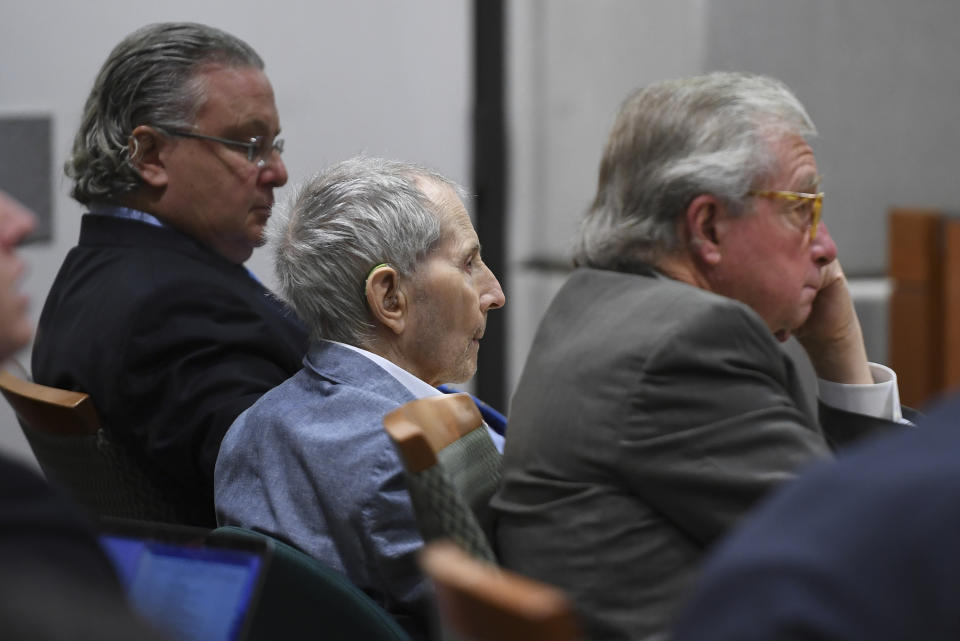 Real estate heir Robert Durst, middle, sits with his defense attorneys, David Chesnoff, left, and Dick DeGuerin during his murder trial at the Airport Branch Courthouse in Los Angeles Thursday, March 5, 2020.After a Hollywood film about him, an HBO documentary full of seemingly damning statements, and decades of suspicion, Durst is now on trial for murder. In opening statements Wednesday, prosecutors will argue Durst killed his close friend Susan Berman before New York police could interview her about the 1982 disappearance of Durst's wife. (Robyn Beck/AFP via AP, Pool)