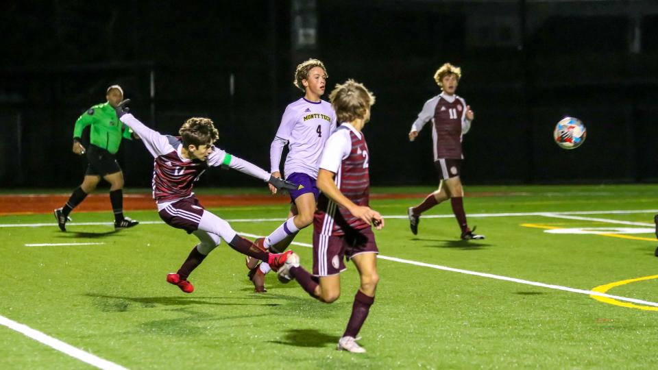 Bishop Stang's Nico Ferreira fires a shot on goal during a playoff game in 2021.
