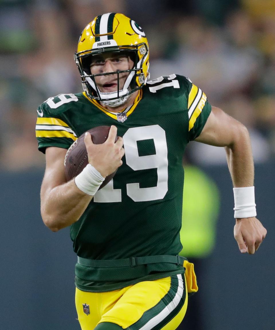 Green Bay Packers quarterback Danny Etling (19) breaks away for a 51-yard touchdown run against the New Orleans Saints in the fourth quarter of a preseason game on Friday at Lambeau Field.