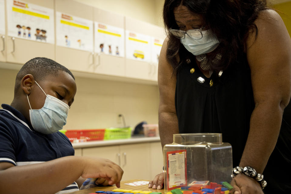 Donylen Bullock works on multiplication with his teacher, Nechia Coleman, during summer school at Ida Green Elementary in Belzoni, Miss., on June 30, 2021. (Brad Vest / for NBC News)