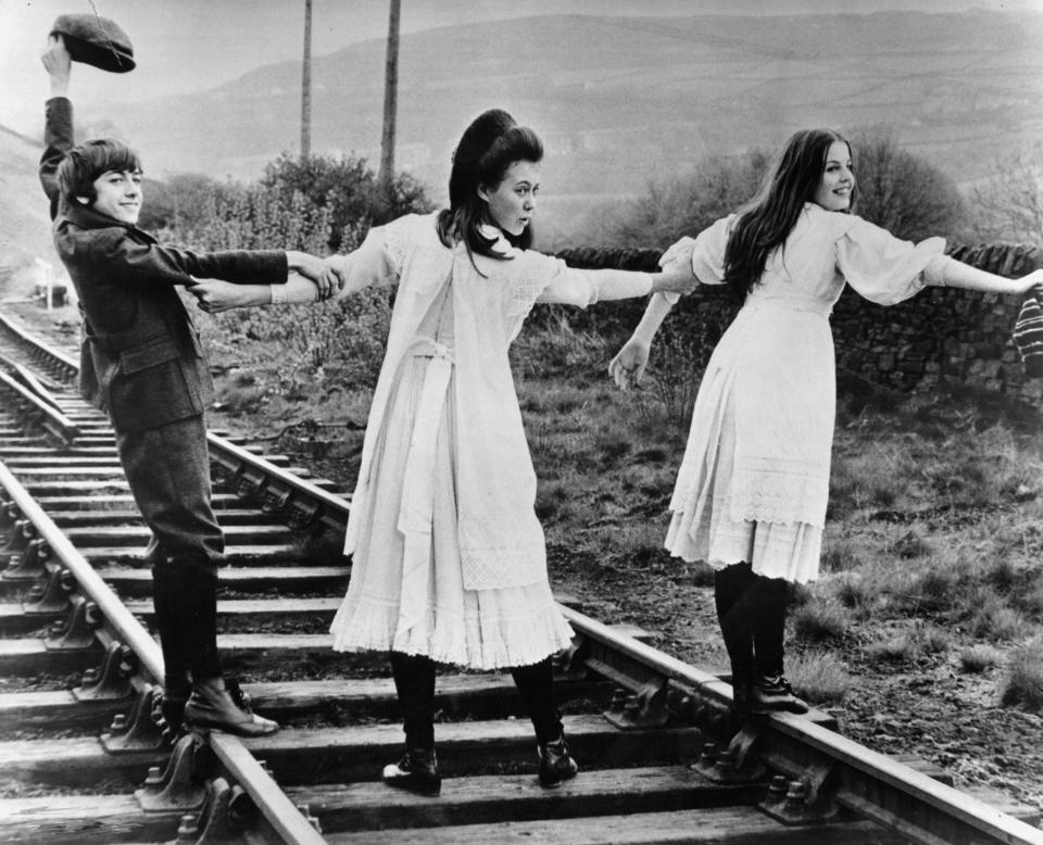 Gary Warren, Jenny Agutter and Sally Thomsett cross a railroad in a scene from the film 'The Railway Children', 1970. (Photo by Universal/Getty Images)