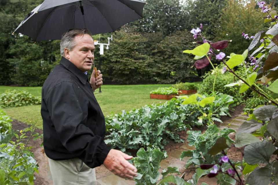 FILE - Dale Haney, Superintendent of the White House Grounds, talks in the first lady Michelle Obama's vegetable and herb garden on the South Lawn of the White House in Washington, Oct. 15, 2009. Haney has been a constant through the past 10 presidencies. As of this month, Haney has tended the lawns and gardens of the White House for 50 years. (AP Photo/Alex Brandon, File)