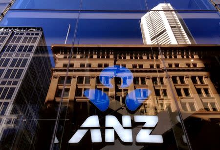 The logo of the ANZ Banking Group is displayed in the window of a newly opened branch in central Sydney, Australia, Aprl 30, 2016. REUTERS/David Gray/File Photo