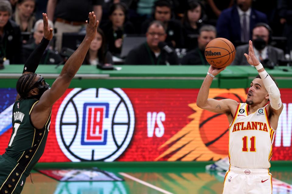 Trae Young shoots the game-winning 29-foot 3-point basket against the Boston Celtics.