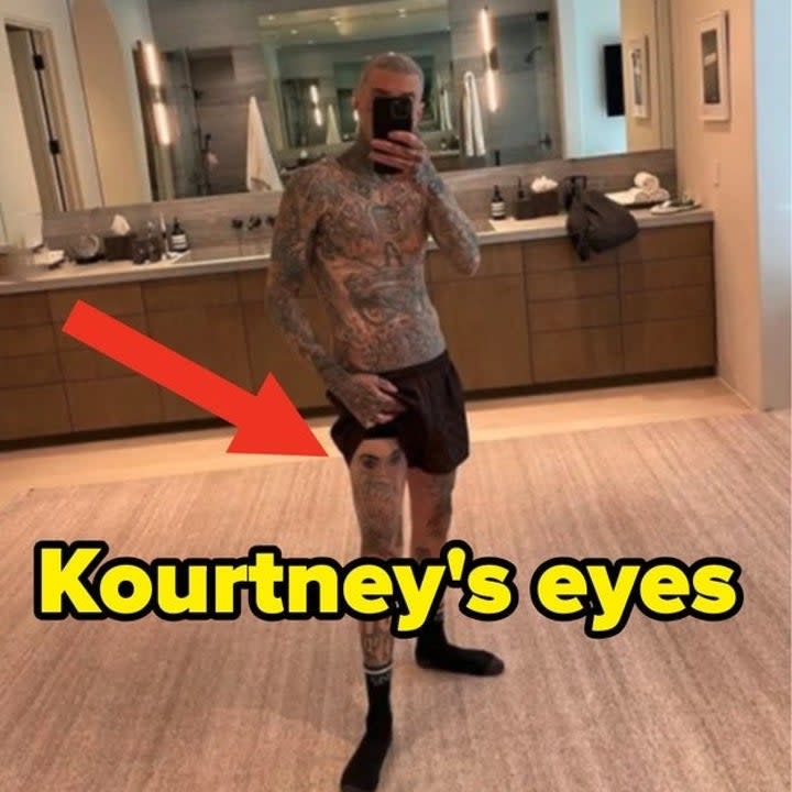 kourtney's eyes tattooed on travis's leg