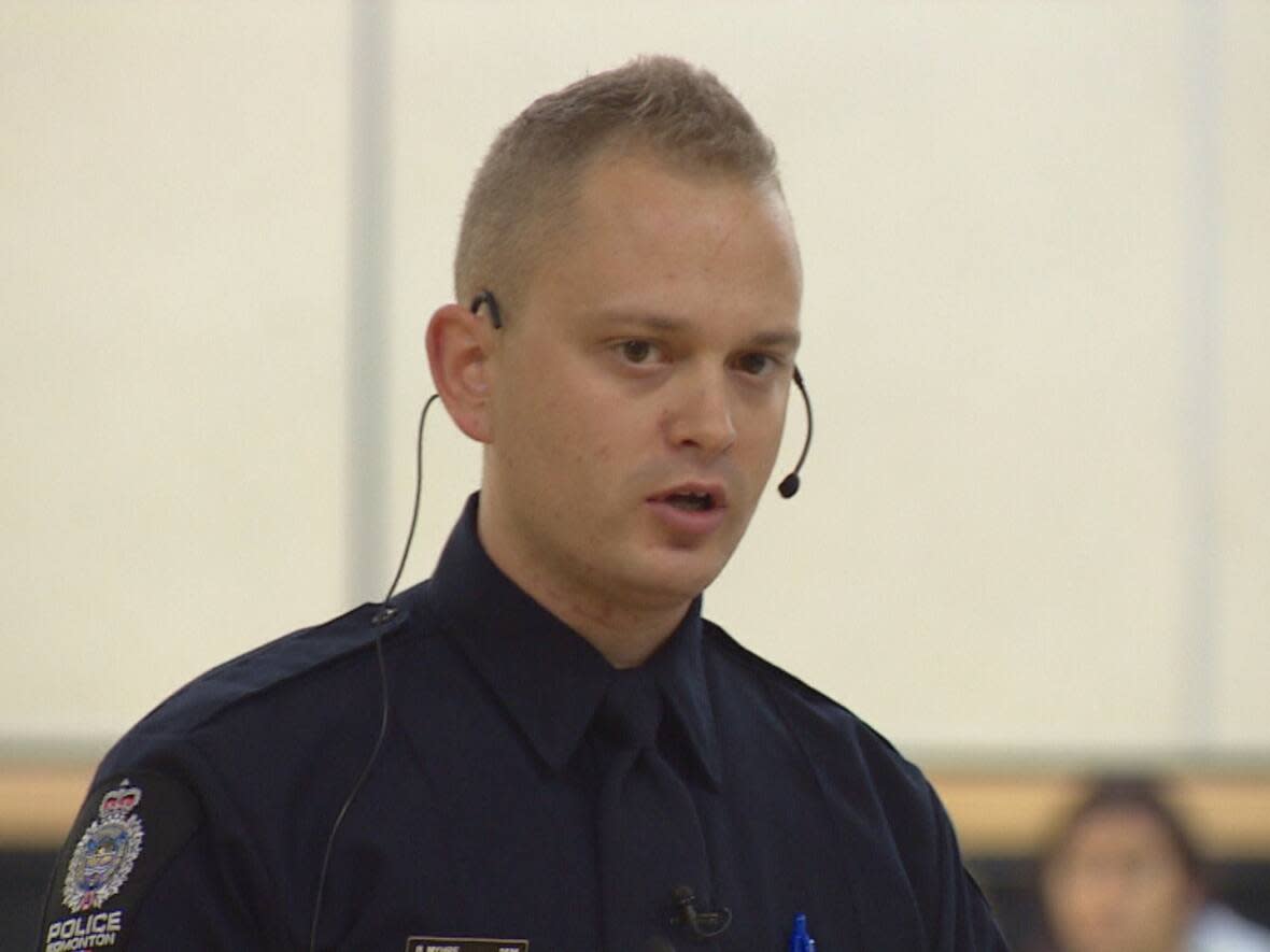 This 2017 file photo shows Const. Brandon Myhre school resource officer at the Mother Margaret Mary High School in Edmonton. Police officers will continue to work in Edmonton Catholic schools after an external review showed broad support for the SRO program.  (Trevor Wilson/CBC - image credit)