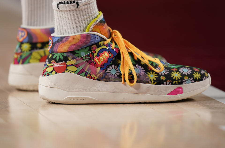 Shoes of Nigeria's Ekpe Udoh (8) are seen during men's basketball preliminary round game between Germany and Nigeria at the 2020 Summer Olympics, Wednesday, July 28, 2021, in Saitama, Japan. (AP Photo/Charlie Neibergall) - Credit: AP