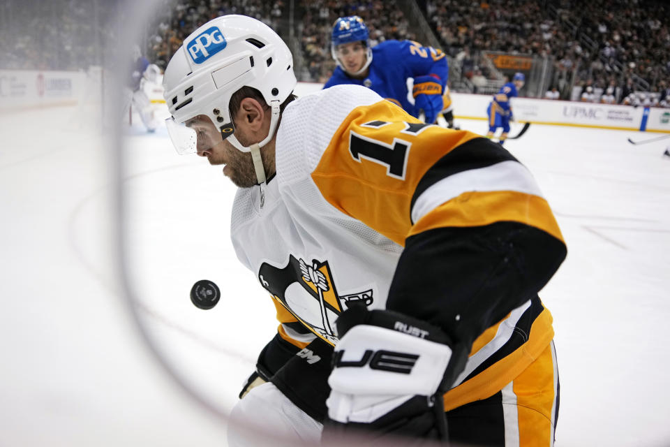 Pittsburgh Penguins' Bryan Rust (17) works to control the puck during the second period of an NHL hockey game against the Buffalo Sabres in Pittsburgh, Saturday, Dec. 10, 2022. (AP Photo/Gene J. Puskar)