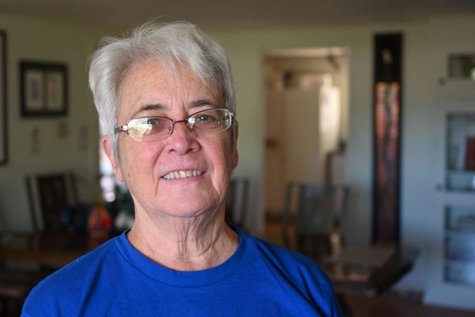 Carolyn Shafer, board chair of the conservation group Patagonia Area Resource Alliance, stands in her home in Patagonia, Arizona. Shafer says she is concerned about how proposed mining projects would affect water sources in the Patagonia Mountains.
