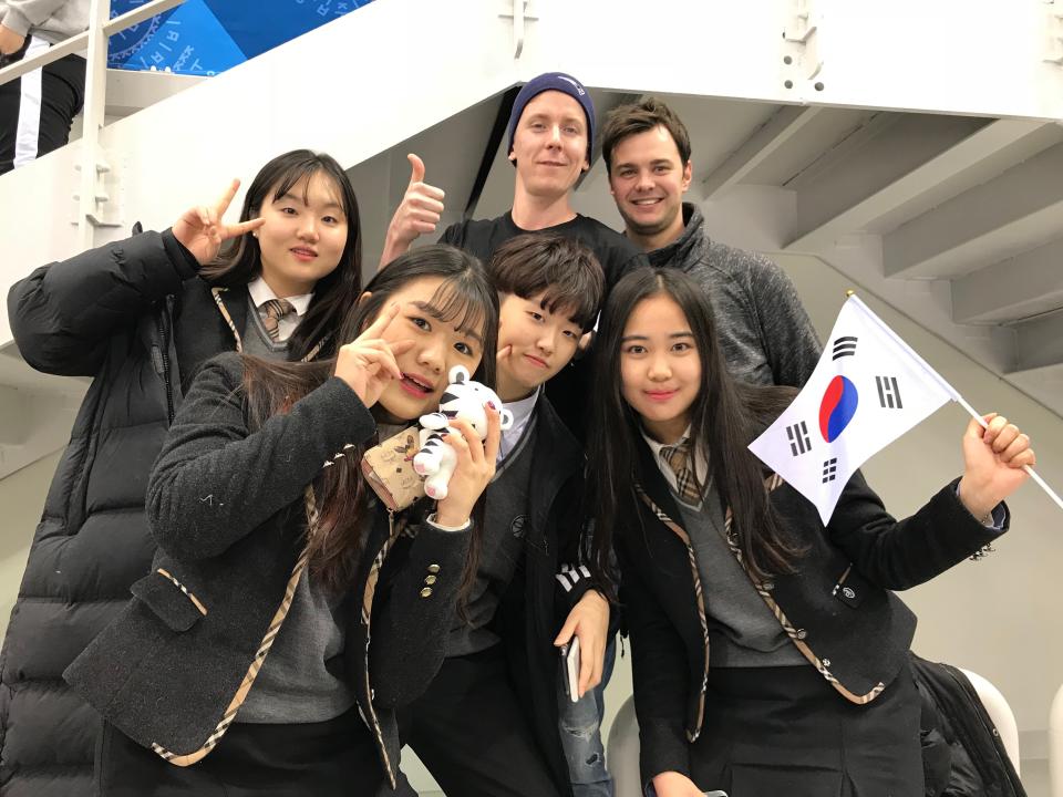 A group of young Korean fans pose with two generous Canadian translators.