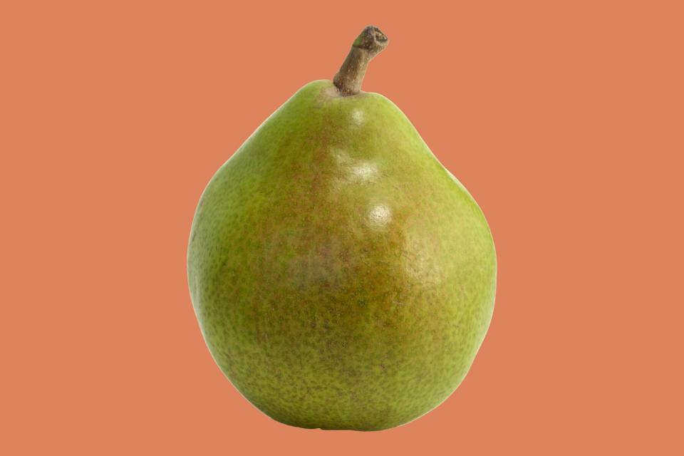 Comice Pear on orange backgroundd