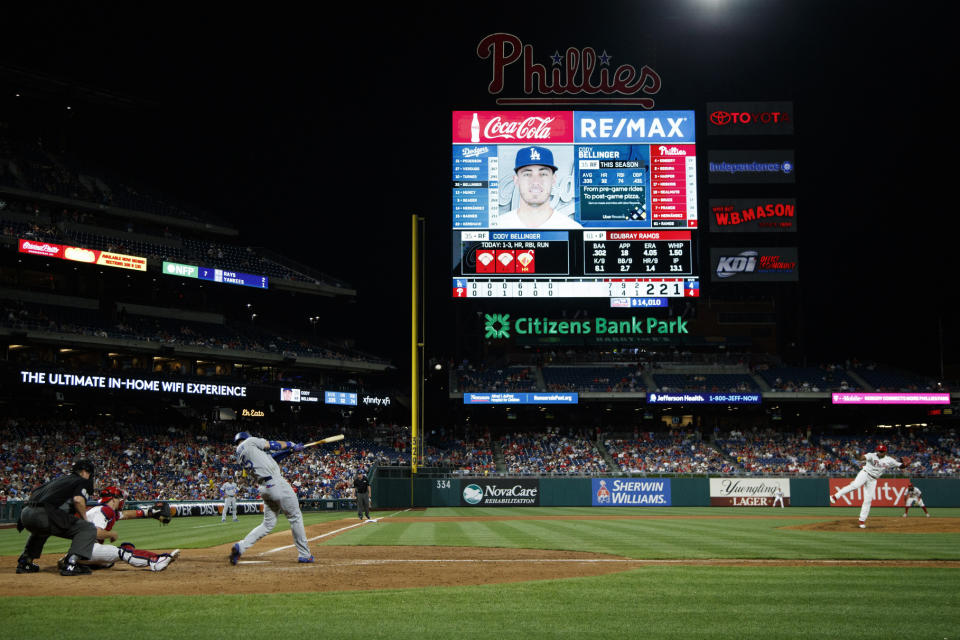 Los Angeles Dodgers' Cody Bellinger, third from left, hits a home run off Philadelphia Phillies relief pitcher Edubray Ramos during the seventh inning of a baseball game, Monday, July 15, 2019, in Philadelphia. (AP Photo/Matt Slocum)