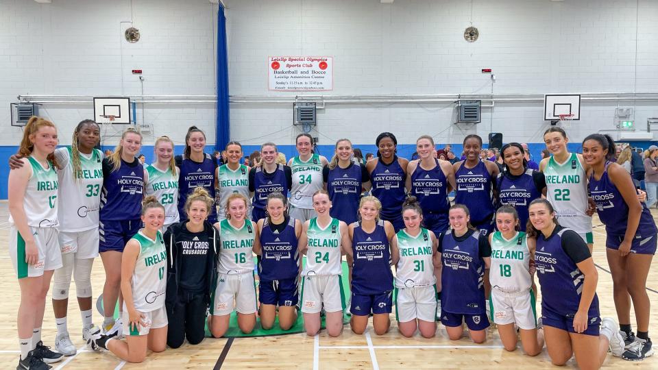 Members of the Holy Cross women's basketball team pose with players from an Irish team during their recent trip to Ireland.