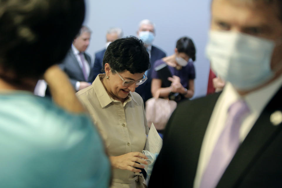 Spain's Foreign Minister Arancha Gonzalez Laya holds a face mask after a news conference with her Cypriot countepart Nikos Christodoulides at the Cypriot Foreign Ministry building in the capital Nicosia, Cyprus, on Wednesday, Sept. 30, 2020. Laya said her visit aimed to convey her country's solidarity with Cyprus amid tensions over a Turkish gas search in waters were Cyprus claims exclusive economic rights. (AP Photo/Petros Karadjias)